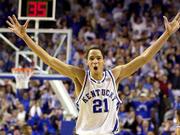 Tayshaun Prince celebrates during the closing moments of Kentucky's
82-62 victory over in-state rival Louisville. Prince had 18 points
and nine rebounds Saturday at Lexington, Ky.