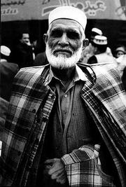 A sport coat merchant poses for a portrait as he makes his rounds
through the Saddar Bazaar in Peshawar.