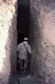 Steve, a Marine master sergeant from Kansas, enters a tunnel in a
valley outside Kandahar, Afghanistan, in this photo from earlier
this month. With the Taliban ousted from power, the battle has
shifted to the painstaking search of caves and other remote
locations for al-Qaida and Taliban renegades and intelligence to
prevent further terrorist attacks.