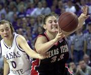 Texas Tech's Jolee Ayers (33) struggles to pass as she is fouled by
Kansas State's Laurie Koehn. K-State won, 76-63, on Sunday in
Manhattan.