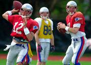 New England quarterbacks Tom Brady, left, and Drew Bledsoe, right,
prepare for Sunday's Super Bowl against St. Louis. Patriots coach
Bill Belichick said after practice Wednesday in New Orleans that
Brady would start against the Rams.