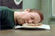 A test subject is unconscious after being struck by a dart from a
blow-gun in this Quizno's commercial.