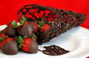 Delectable creations like this semisweet chocolate lace cone filled
with chocolate-covered strawberries will be featured in the 14th
annual Baldwin Community Art Council Chocolate Auction. The auction
is set for Sunday at Baldwin High School.