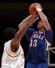 Jeff Boschee fires off a three. Boschee hit six three-pointers,
including two in overtime, in the Jayhawks' 110-103 overtime
victory over Texas.