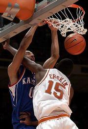 Kansas' Drew Gooden, left, dunks on Texas' Deginald Erskin. Gooden
had 28 points in the Jayhawks' 110-103 overtime victory over the
Longhorns on Monday in Austin, Texas.