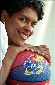 Lynette Woodard, former Kansas University basketball player and a
current assistant coach for the team, is a Kansas Sports Hall of
Fame inductee.