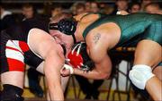 Free State's Justin Stevens works for control against Mike Bowyer
of Wichita Heights. Stevens defeated Bowyer, 3-2, on Friday at
Wichita in the first round of the Class 6A state tournament.
Stevens will wrestle for the 189-pound championship today at Kansas
Coliseum.
