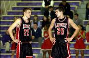 Lawrence High senior guards D.J. Watkins, left, and Stephen Vinson,
seen talking strategy during the Topeka Invitational Tournament in
January, average a combined 33.5 points a game for the Class 6A
state tournament-bound Lions.