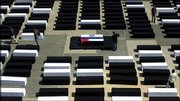 Israelis walk among coffins set up by an Israeli peace activist
group in Tel Aviv. The white coffins represent the Israelis, and
black coffins the Palestinians killed in the latest round of
fighting. Two coffins in the center are covered by Israeli and
Palestinian flags.