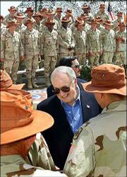 Vice President Dick Cheney greets Arkansas National Guard troops on
peacekeeping duty in Sharm el-Sheikh, Egypt, during his Middle East
mission to build support for President Bush's anti-terrorism
campaign.