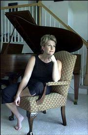 Joyce DiDonato, a Kansas City area opera singer, has received the
2002 Richard Tucker Award, considered opera's most
prestigiousprize. She is shown at her Clay County, Mo., home in
this August 2001 photo. The annual award carries a cash prize of
$30,000.