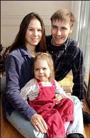Juliana and Marty Haught are among the area families trying to
start a Waldorf school in Lawrence. They think the alternative
style of teaching would benefit their 3-year-old daughter, Natalie.