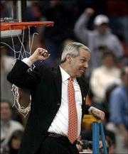 Kansas is celebrating its first Final Four berth since 1993. Coach
Roy Williams, shows his happiness at a net-cutting ceremony after
the Jayhawks' 104-86 win Sunday over Oregon.