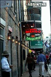 The Old Absinthe House Bar sign still hangs on the building where
the Mango Bar now sells frozen daiquiris on Bourbon Street in New
Orleans. Musical heritage preservationists hold up the change at
the former blues bar as another example of how local landmarks are
deteriorating in New Orleans.