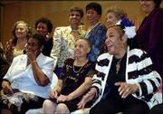 Clora Bryant, right front, breaks out laughing as the Prairie View
Co-Eds gather for a group picture during a reception in their honor
in Houston. The members of the historic Prairie View A&M
all-girl jazz band gathered for the first time in more than 50
years for a two-day celebration held by the university in their
honor. Back row from left are Ernest Crafton Miller, Argie Mae
Edwards Medearis, Izola FedFord Collins, Elizabeth Thomas Smith and
Marion Bridges Simon; front row, from left, are Helen Cole, Fannie
Drisdale Burt and Bryant.