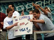 Rating "the Gooden, the Bad and the Ugly," Kansas fans display a
sign for TV cameras. This group was mugging for the cameras Friday
during an open practice session at the Georgia Dome.