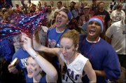 Kansas University students, from left, Alex Stout, Jeff Wyssenbach
and Megan Haas, all Wichita sophomores, and Mike Crawford, a St.
Louis junior, join in a Rock Chalk cheer. The four were taking part
in a pregame KU pep rally Saturday at the J.W. Marriott Hotel in
Atlanta.