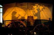 Pioneer women are silhouetted on the side of a covered wagon as
part of a display at the Oregon Trail Interpretive Center in Baker
City, Ore. To remind visitors of the perilous Oregon Trail journey
made by long-ago travelers, museums, wayside stops and parks have
been built along the way, offering a glimpse of the struggles of
those who helped open up the West.
