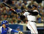 San Francisco's Barry Bonds hits his second home run of the game a
solo shot in the fourth inning. After hitting two homers Wednesday
in Los Angeles, Bonds, the reigning home run king, has four homers
in two games this season.
