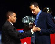 Outgoing Kansas assistant coach Neil Dougherty, left, presents Drew
Gooden with the Bill Bridges Rebounding Award. Gooden also
collected the Dr. Forrest C. "Phog" Allen MVP Award at the
Jayhawks&squot; annual award ceremony on Monday at the Lied Center.
Dougherty is headed to Texas Christian University, where he will be
head coach.