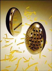A new line of tools from Resourceful Products Inc. is based on the
egg. The company says that shape is the best for gripping and
squeezing. Shown here are the cheese plane and grater, left, and
the general purpose grater. They have no handles and work directly
on the food surface.