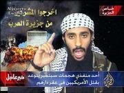 In this image taken from video broadcast by the Al-Jazeera
satellite television network, a man who was identified by
Al-Jazeera's editor-in-chief as Ahmed Ibrahim A. Alhaznawi speaks
in an undated video tape. Al-Jazeera editor-in-chief Ibrahim Hilal
said the excerpts presented Monday were from an hour-long video,
complete with narration and graphics, delivered by hand to the
station's Doha, Qatar offices a week ago. Superimposed caption at
bottom center reads, "One of the implementors of the Septebmer
attacks threatens to kill Americans in their homes."