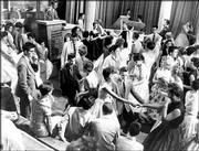 "American Bandstand," which first broadcast in 1952, will celebrate
its 50th anniversary with "American Bandstand's 50th ... A
Celebration!" on Friday. Dick Clark, at podium at upper left, is
surrounded by teen-age fans on his nationally televised dance show
"American Bandstand" in Philadelphia in this June 30, 1958, file
photo.