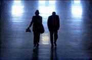 Representatives Barbara Ballard, D-Lawrence, and Eber Phelps,
D-Hays, walk through the halls of the Topeka Statehouse. The Kansas
House advanced a bill Friday that would allow casinos at
pari-mutuel racetracks and Dodge City. Ballard played a key role in
reviving the bill after it was initially thought to have been
killed.