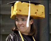 Cheesehead Rebecca Evans of Plover, Wis., surveys the crowd
gathering for commencement. Evans, a Green Bay Packers fan, earned
a bachelor's degree in political science.