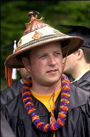 Xavier Stevens, Garnett, wore a straw hat in place of his
mortarboard. He was awarded a bachelor's degree in computer science
from KU's engineering school.