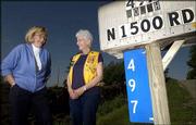 Teresa Smith, Lions Club president, left, and president-elect
Martha Roush are selling reflective address signs for county
residences. The signs, like the one attached to Roush's rural
mailbox, have been endorsed by the sheriff's and rural fire
departments.