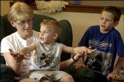 At age 27, Melissa Wingert, Lecompton, was diagnosed with bone and
breast cancer. After a double mastectomy and the removal of
portions of her right cheekbone, eye socket and jaw, she is
recovering at home and enjoying her sons Colton, 3, and Blake, 6.