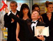 French Director Roman Polanski reacts as he is awarded the Palme
d&squot;Or for the film "The Pianist" during the awards ceremony of the
55th Film Festival in Cannes, France. The Palme d&squot;Or is the
festival&squot;s top prize.