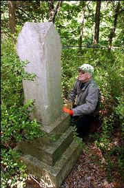 Ralph King Jr. likes to visit the secluded Kennedy family cemetery
on his property in rural Douglas County. Private family cemeteries
aren't likely to draw many for Memorial Day ceremonies today, but
the Douglas County Genealogical Society has information about where
some can be located.
