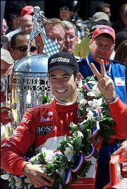 Winner Helio Castroneves celebrates his second consecutive
Indianapolis 500 victory after winning Sunday's race.
