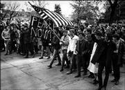 Kansas University students march on Jayhawk Boulevard in the late
1960s to protest the Vietnam War. Kansas University alumnus Rusty
Monhollon, who wrote "This Is America?: The Sixties in Lawrence,
Kansas," will read from his work and sign books today at The Raven
Bookstore, 8 E. Seventh St.