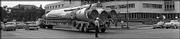A lone police officer stops traffic in 1962 as an Atlas
Intercontinental Ballistic Missile traveled down Topeka Ave. on its
way to a base southwest of the Kansas Capital. In the early 1960's
there were 19 Atlas missile launch sites in Kansas. Before the
missile went into service it was fitted with a 1 to 4 megaton
nuclear warhead. Missiles were placed in Kansas and Missosuri
because the U.S. government thought there would be less chance of
anti-war demonstrations.