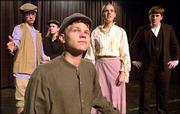 Summer Youth Theater is working on a production of "Oliver" that
will open Thursday night at the Lawrence Arts Center, 940 N.H. Cast
members, from left, are, Robby Kocour, who plays an orphan; Erin
McDowell, who is the Artful Dodger; Andrew Bullington, who plays
Oliver; Jessica Foulke, who is Nancy; and Andrew Algren, who plays
Mr. Bumble.