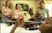 From left, Ariel George, 15, Jacquelyn Samp, 15, and Dhwani Shah,
15, joke with Lois Jones, front. The three visited with Jones
during the Youth Volunteer Council's trip Saturday to Brandon Woods
Retirement Community, 1501 Inverness Drive. It was the first
service project for the group, which has been meeting since April
under the direction of the Roger Hill Volunteer Center.
