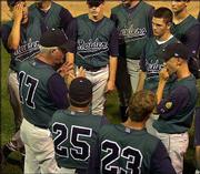 Lawrence coach Carl Brooks gives the Raiders a post-game talk.
Lawrence knocked off Tulsa Memorial, 5-4, at the Al Ice Memorial
Woodbat Classic on Saturday night at Kansas University.