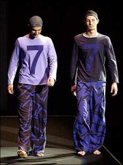 Large trousers and shirts were shown Wednesday at the Emporio
Armani men's fashion collection. Casual styles ruled in most summer
2003 collections.