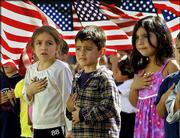 Students at Nevada Avenue Elementary School recite the Pledge of
Allegiance as part of October 2001 nationwide ceremonies to honor
America in the Canoga Park district of Los Angeles&squot; San Fernando
Valley. For the first time ever, a federal appeals court Wednesday
declared the Pledge of Allegiance unconstitutional because of the
words "under God" added by Congress in 1954. The ruling, if allowed
to stand, means schoolchildren can no longer recite the pledge, at
least in the nine Western states covered by the court.