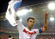 Turkey's Hakan Sukur waves a South Korean flag. Turkey won the
third-place World Cup match, 3-2, on Saturday in Daegu, South
Korea. Story on page 8C.