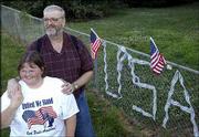 With the letters U-S-A woven into their fence, Dan and Hollyce
Morris put their patriotism on display at the intersection of
Kasold Drive and Eighth Street. The Morrises erected the display
after the Sept. 11 attacks, and on Tuesday they said they had no
plans to take it down. For the Fourth of July holiday, the Morrises
said they most likely just would relax and enjoy the day.