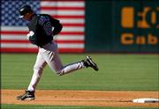 Kansas City's Raul Ibanez rounds second base after hitting a solo
home run against Oakland. The Athletics came from behind and
defeated the Royals in the bottom of the ninth inning for the
second straight game, winning 4-3 on Friday in Oakland, Calif.