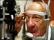 Ernest Hayeck, 77, has his eye's retina examined during a check-up
in Boston. After four treatments with the experimental drug rhuFab
to treat his macular degeneration, Hayeck's sight went from 20-100
to 20-20, with his glasses on.