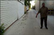 Stephen Dowdell visits the spot where his brother Rick Dowdell was
killed by a Lawrence policeman on July 16, 1970. Rick Dowdell was
shot by police in the alley, near Ninth and Rhode Island streets,
that is behind what is now the Lawrence Arts Center.