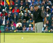 South Africa's Ernie Els watches as his ball comes up short of the
pin after playing from off the 14th green. Els shot a 5-under-par
66 during the second round of the British Open on Friday at
Muirfield golf course in Gullane, Scotland.