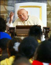 Pope John Paul greets the crowd at the ceremony for World Youth Day
Thursday at Exhibition Place in Toronto, Ontario.