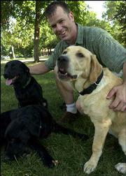 When Doug Yetman isn't running Mojo's restaurant, he spends much of
his free time with his three Labrador dogs from left, Cinder,
Duncan and Thelma Lou. Yetman was nominated by his sister, who
lives in Los Angeles.